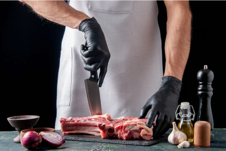 chef slicing pork